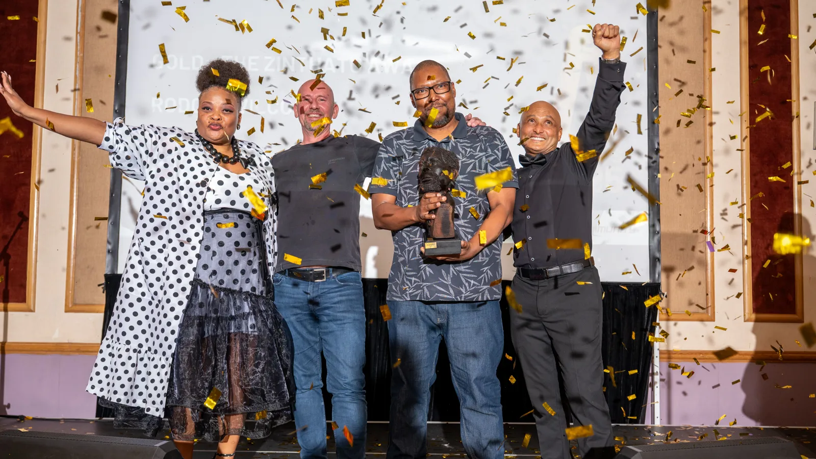 Assegai Awards 2025 winners celebrating on stage with confetti and a trophy